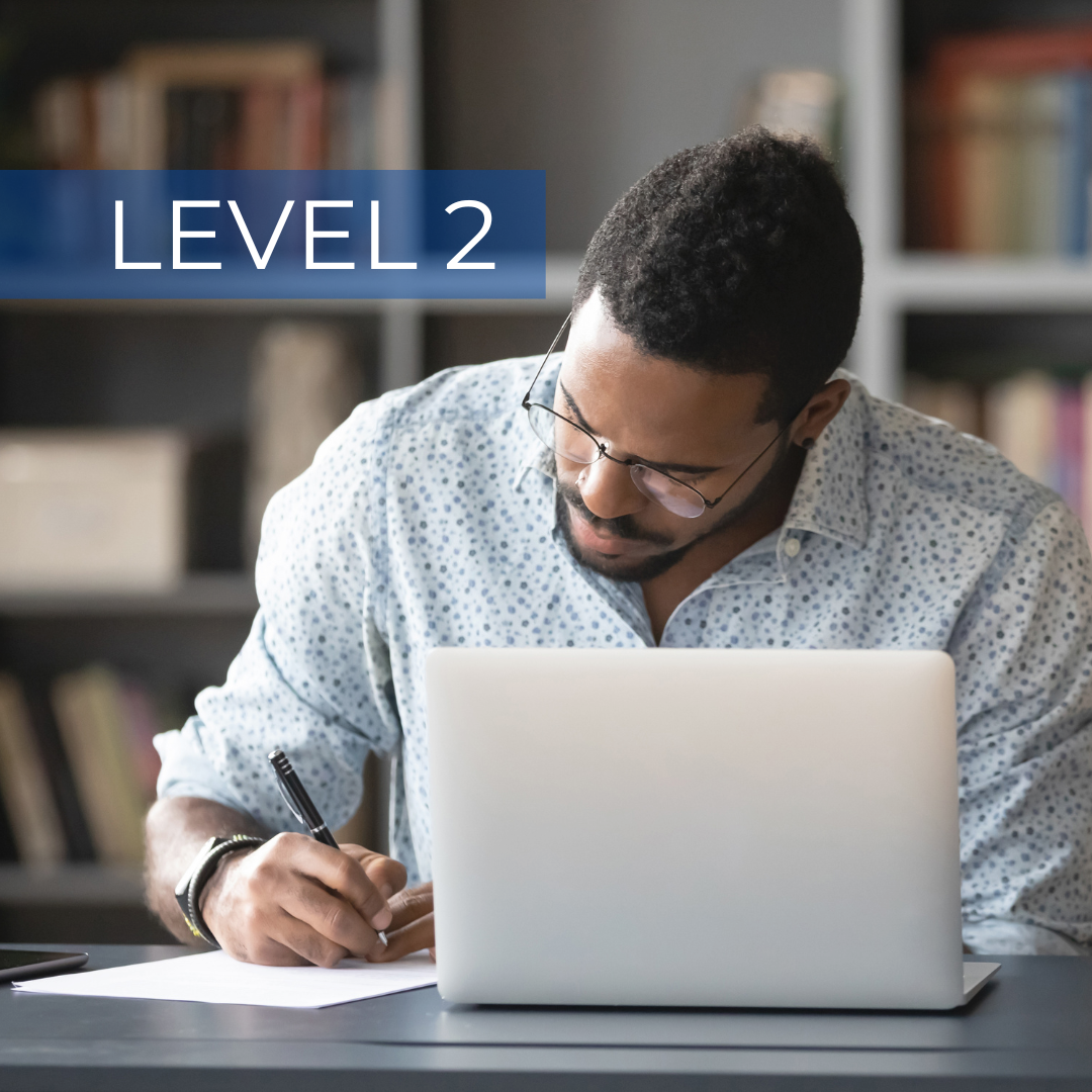 Level 2 training, a man taking notes at his laptop
